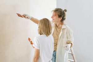 mother and son painting the wall